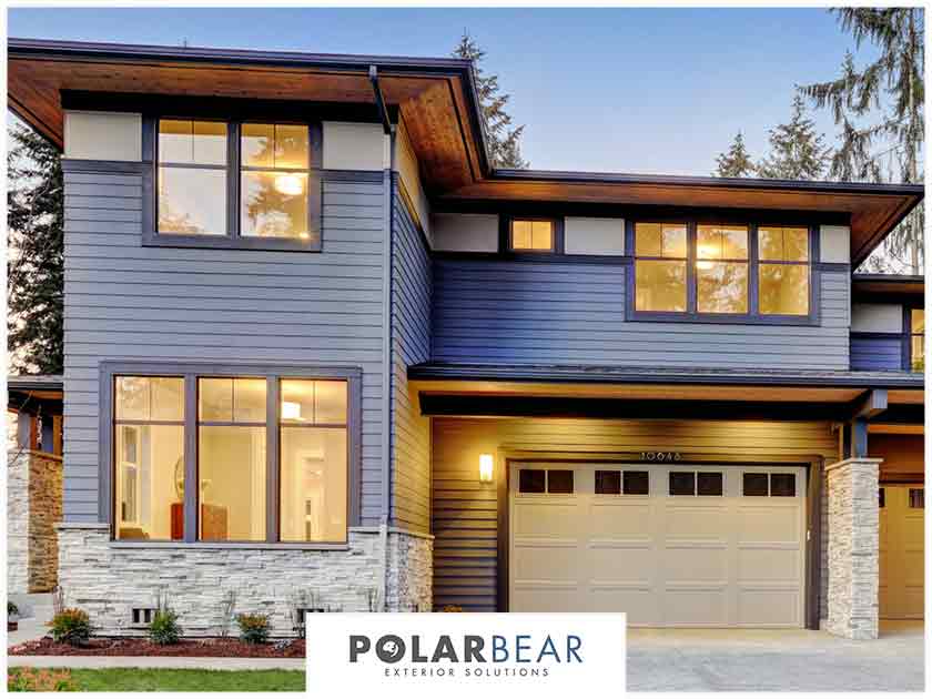 Blue lap siding with newly installed windows